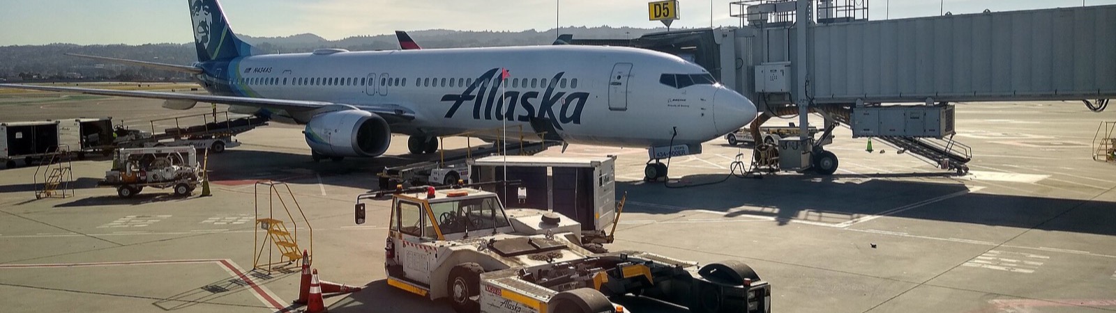An Alaska Airlines Boeing 737 at a gate at San Francisco International Airport