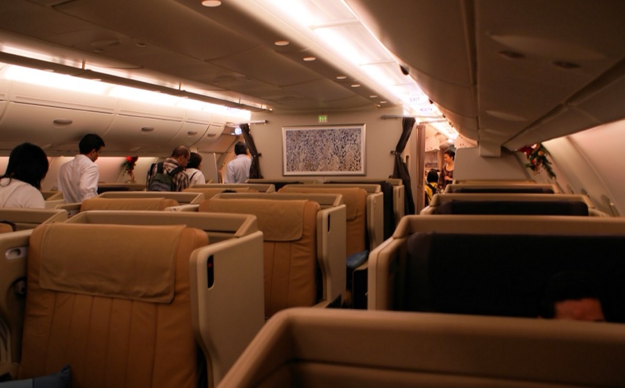 The business class cabin on a Singapore Airlines Airbus A380, with wide tan leather seats